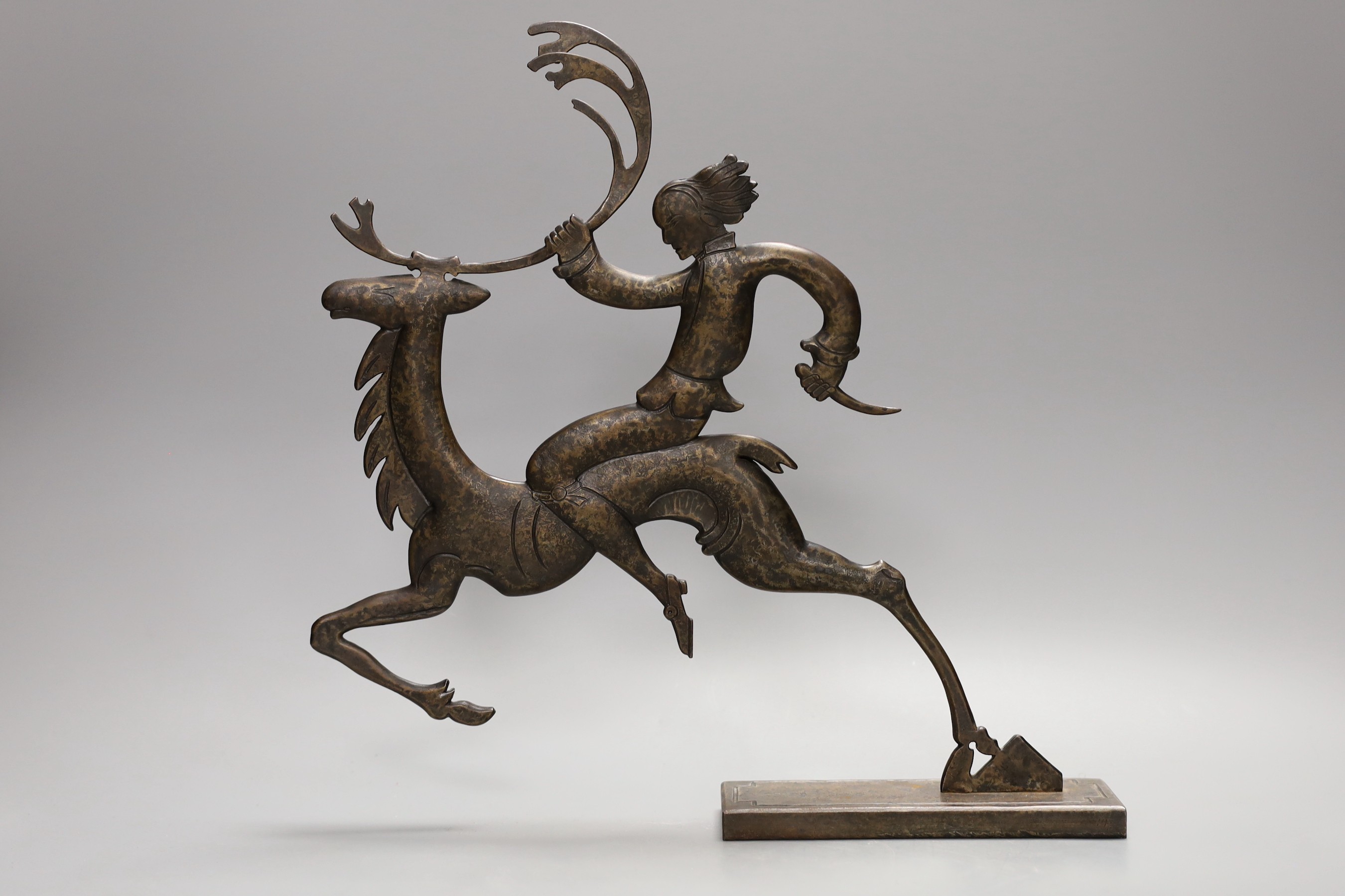 A stylised bronze figure and a metal figure of a dancer, tallest 31cm